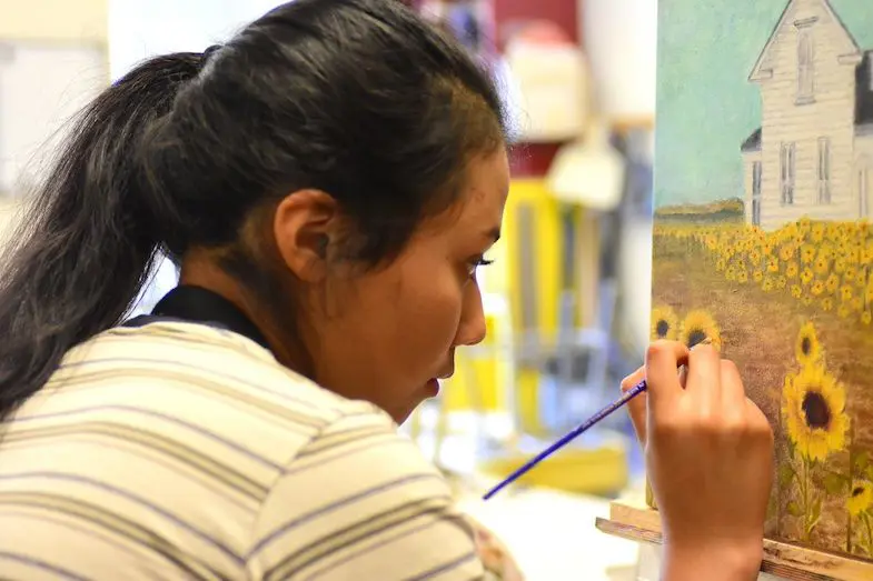 Students can choose from 18 different art classes. Performing arts options include Music Ensembles, Improv, 10-Minute Plays, Film Studies, Tech, and Combat Theater. Visual arts options include Ceramic